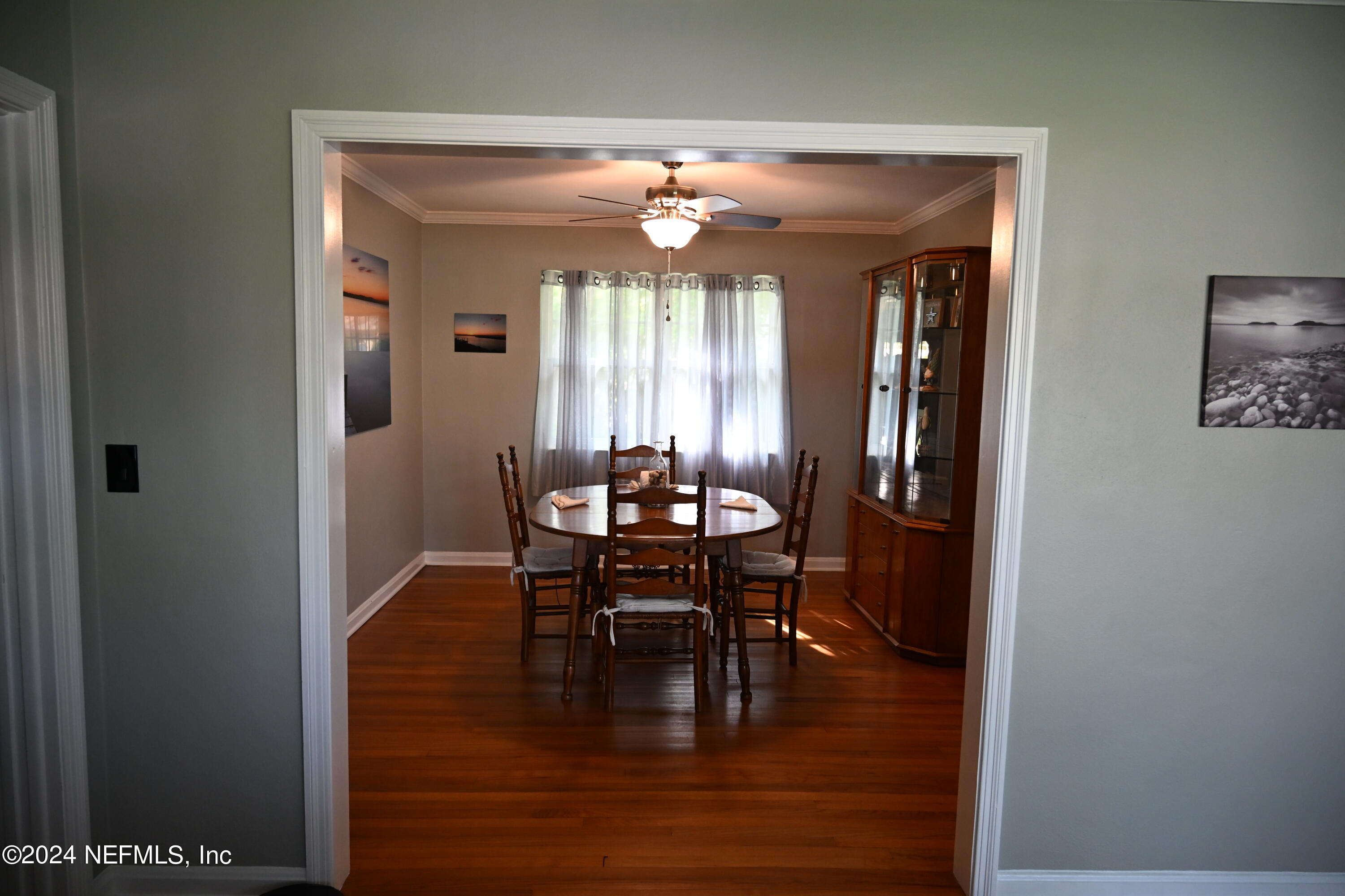 5054 Pirates Cove Road Jacksonville, FL 32210 - Photo 22 of 27 a dining room with furniture and window