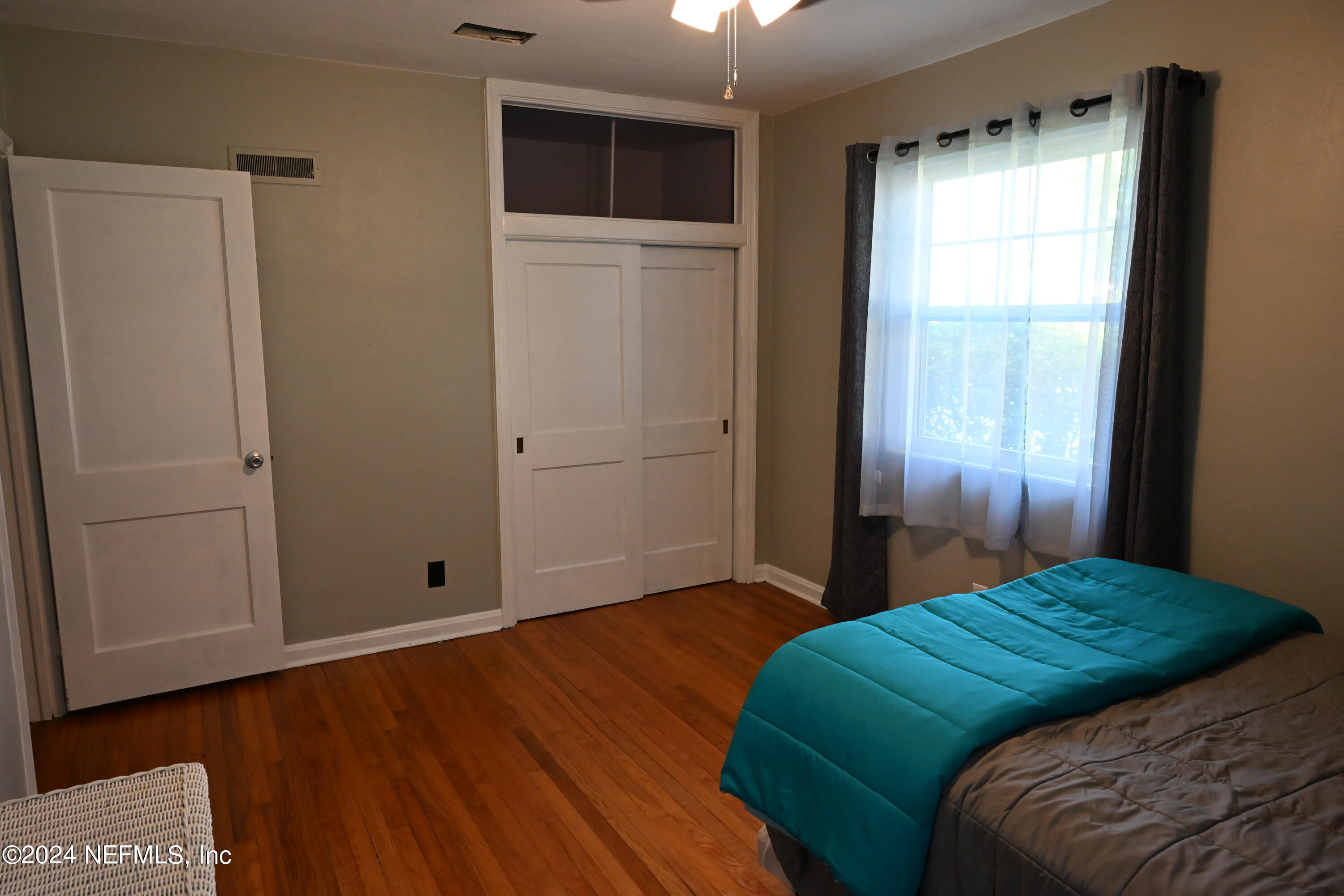 5054 Pirates Cove Road Jacksonville, FL 32210 - Photo 23 of 27 a bedroom with a bed and a window
