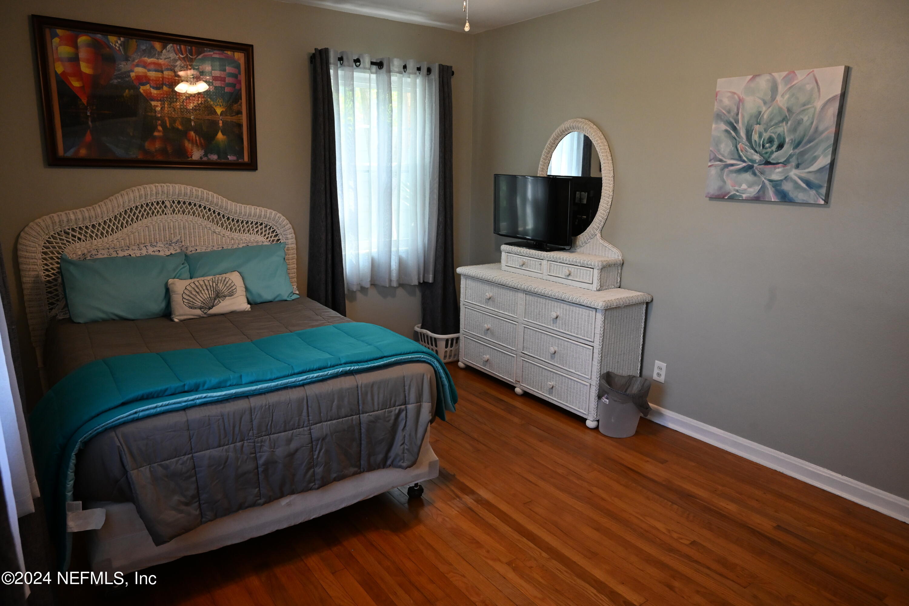 5054 Pirates Cove Road Jacksonville, FL 32210 - Photo 24 of 27 a bedroom with a bed and a television on dresser