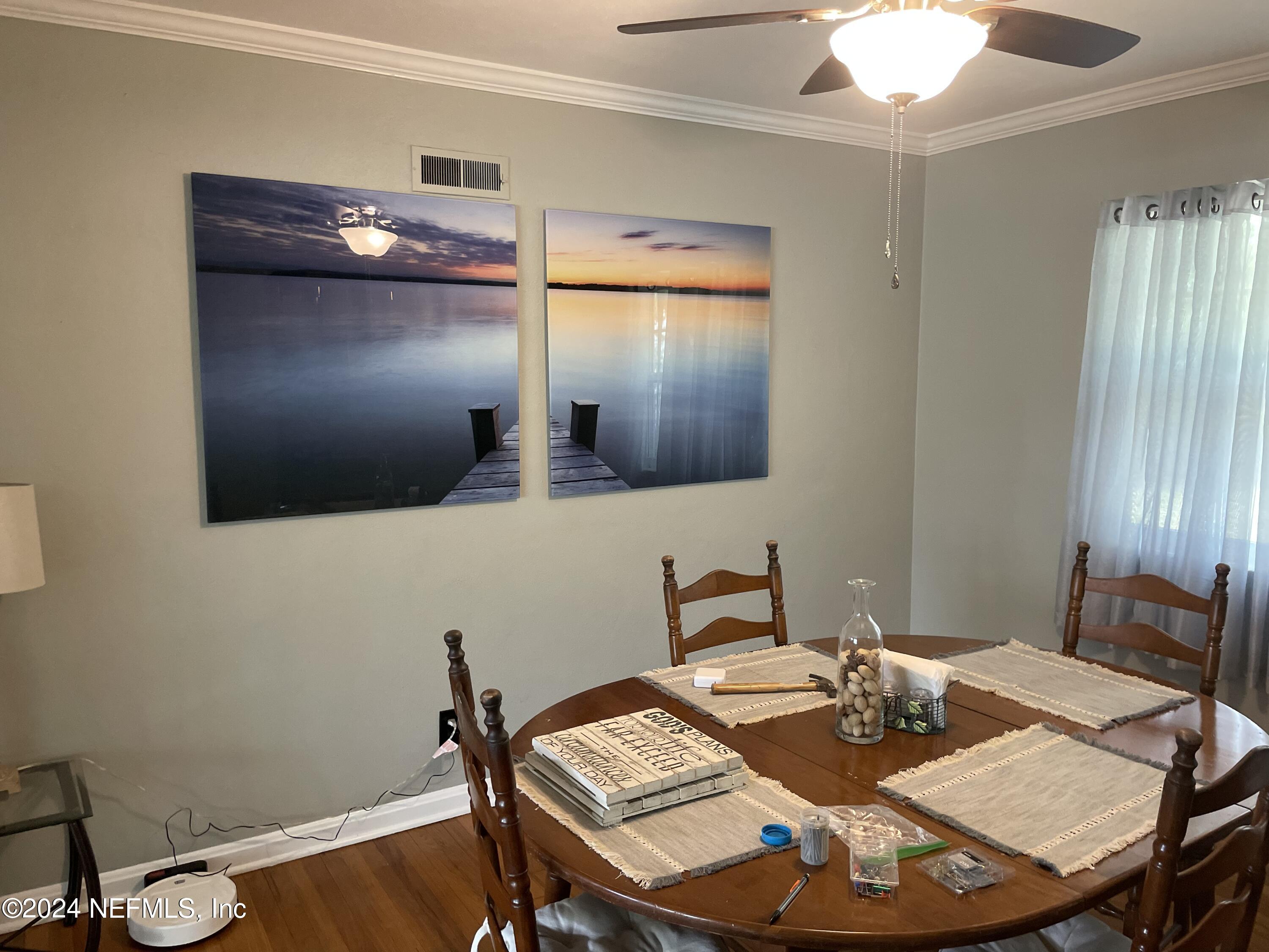 5054 Pirates Cove Road Jacksonville, FL 32210 - Photo 3 of 27 a view of a dining room with furniture
