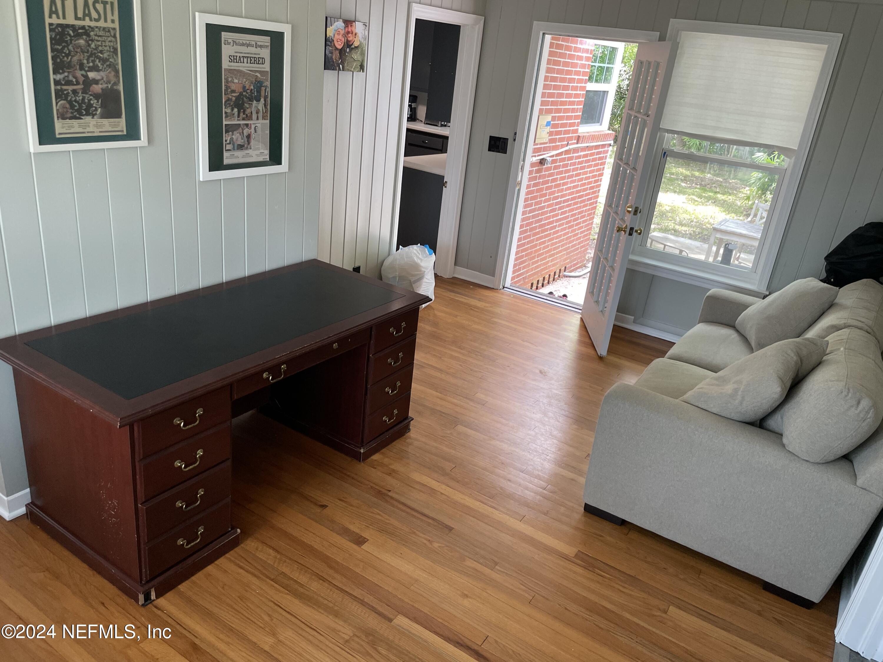 5054 Pirates Cove Road Jacksonville, FL 32210 - Photo 6 of 27 a living room with furniture and a wooden floor