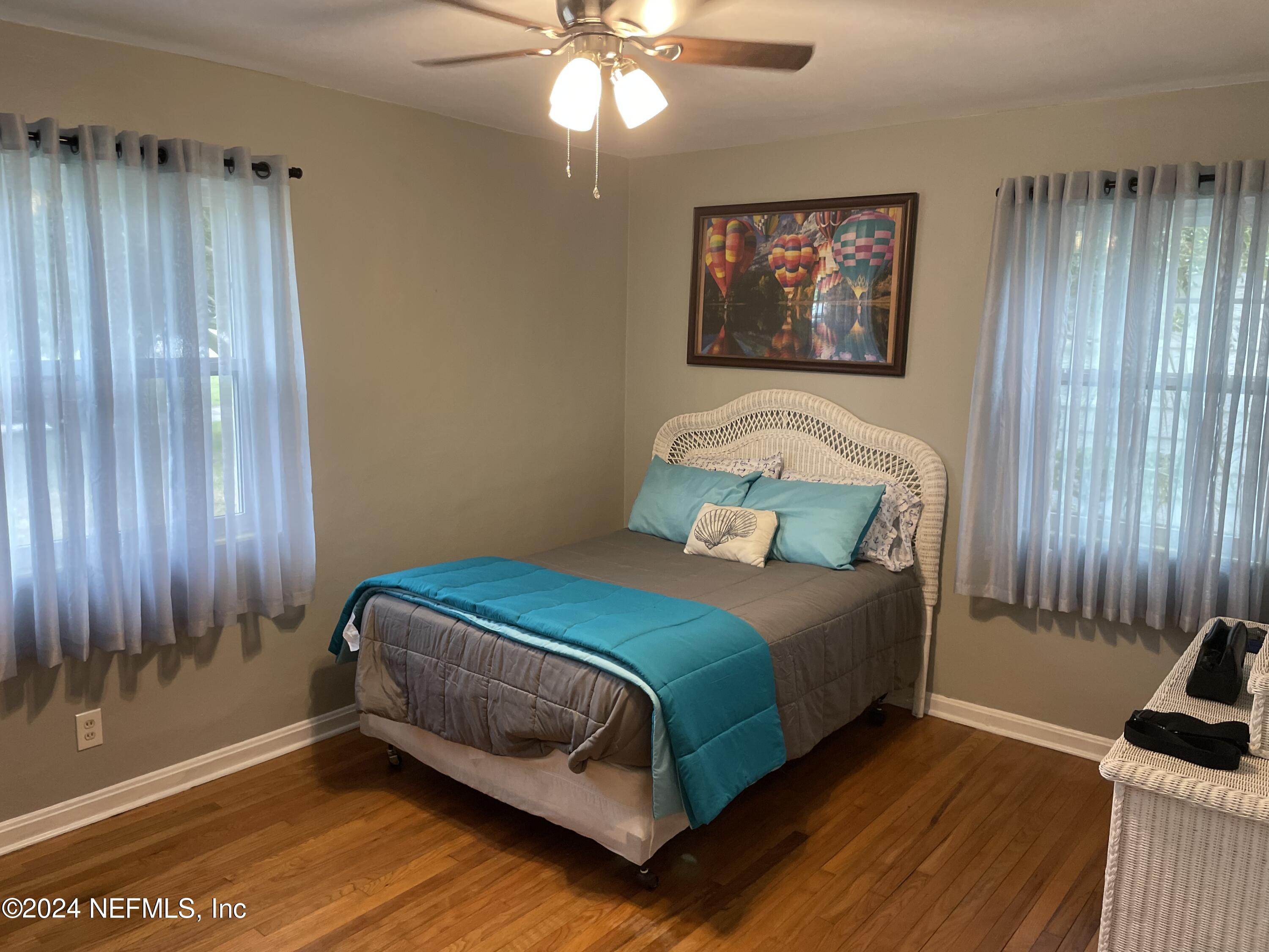 5054 Pirates Cove Road Jacksonville, FL 32210 - Photo 8 of 27 a bedroom with a bed and a window