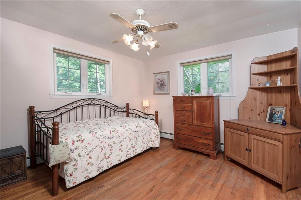 137 South McCoy Pl Road Sewickley, PA 15143 - Photo 17 of 25 Second Bedroom with Hardwood Flooring and a Ceiling Fan for Warmer Weather