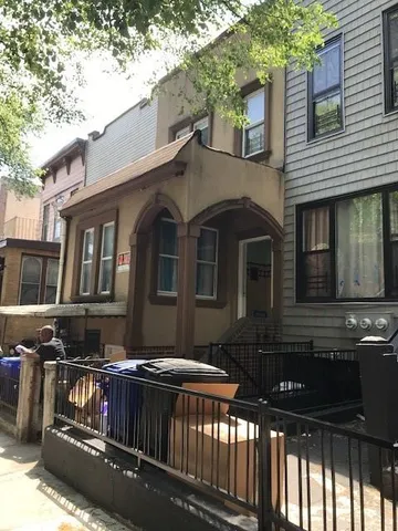 a front view of a house with balcony