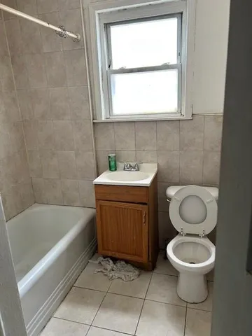 a bathroom with a sink a toilet and a bathtub