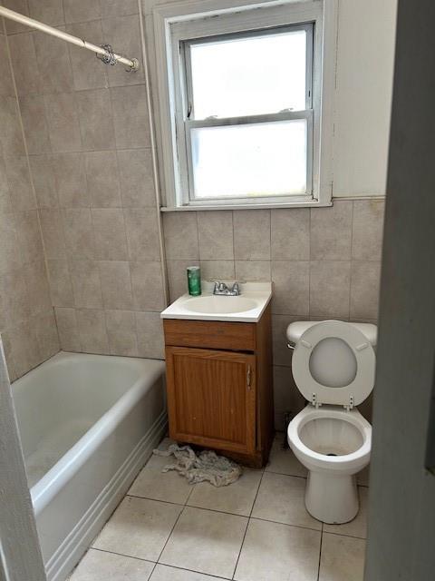 12 Pleasant Place Brooklyn, NY 11233 - Photo 7 of 12 a bathroom with a sink a toilet and a bathtub