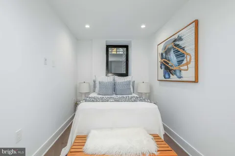 a view of hallway that has painting on the wall