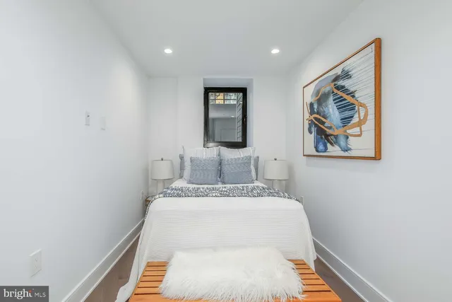 a view of hallway that has painting on the wall