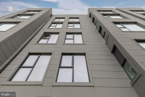 a view of a balcony with windows