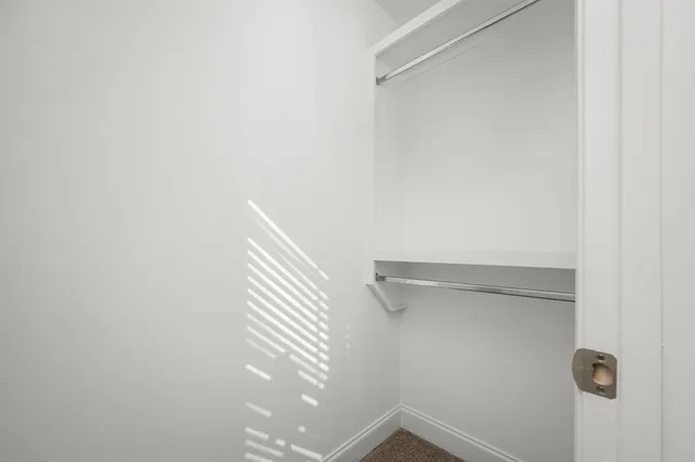 a bathroom with a shower sink vanity and mirror