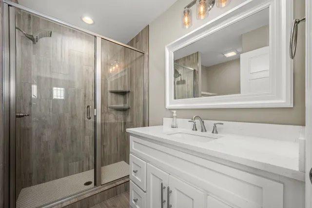 a bathroom with a toilet and a shower