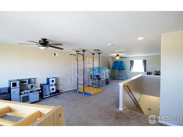 a living room with furniture and a pool