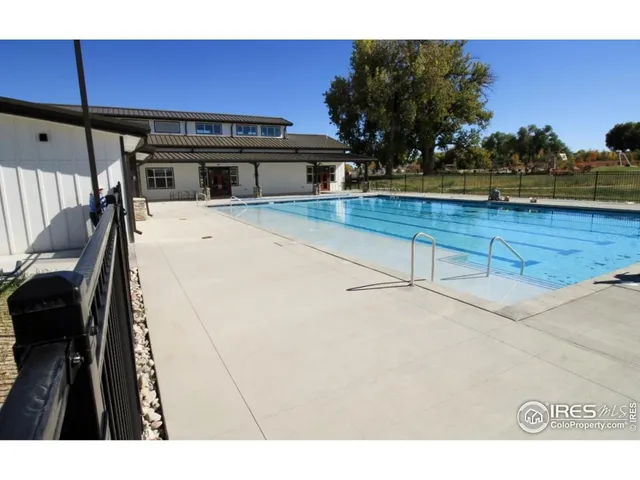 a view of a living room and kitchen