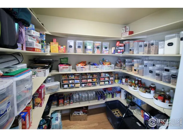 a room with lots of books and a book shelf