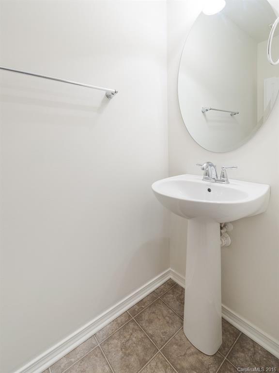 708 Elders Story Road, Unit NONE Fort Mill, SC 29708 - Photo 14 of 24 a bathroom with a sink a mirror and vanity