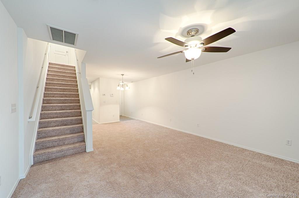 708 Elders Story Road, Unit NONE Fort Mill, SC 29708 - Photo 3 of 24 a view of an empty room with a ceiling fan