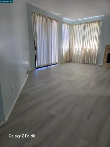 an empty room with wooden floor