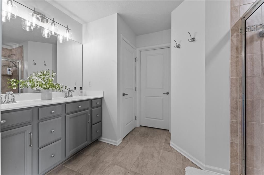 110 Brook Side Drive Clinton, PA 15026 - Photo 26 of 49 a bathroom with a double vanity sink and mirror