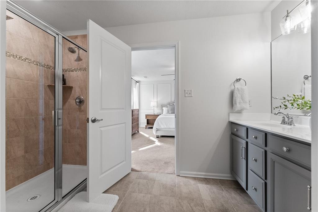 110 Brook Side Drive Clinton, PA 15026 - Photo 27 of 49 a en suite bathroom with a shower sink and mirror