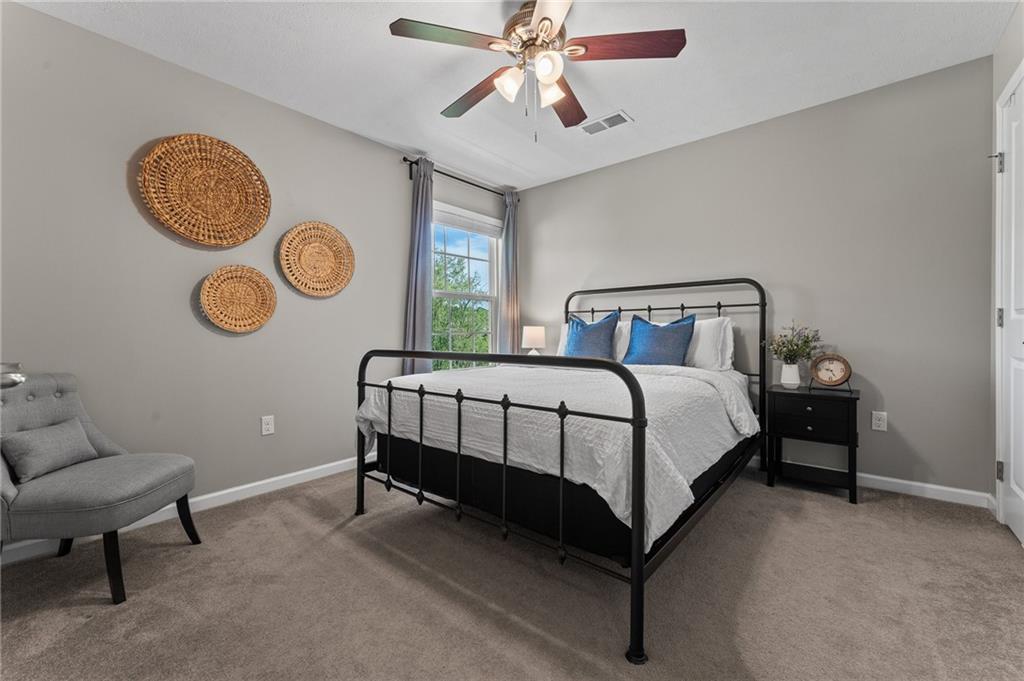 110 Brook Side Drive Clinton, PA 15026 - Photo 30 of 49 a bedroom with a bed and a lamp on dresser