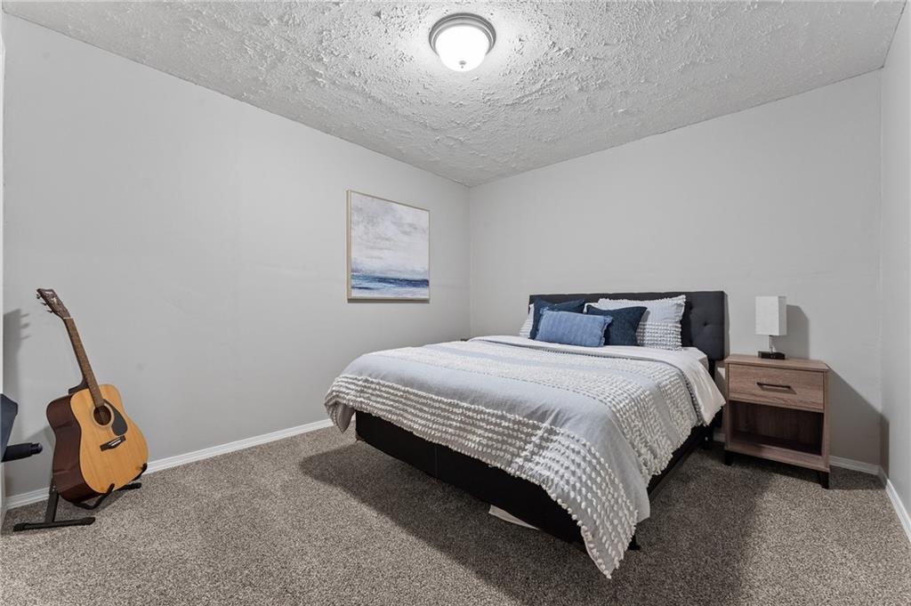 110 Brook Side Drive Clinton, PA 15026 - Photo 37 of 49 a bedroom with a bed and a window