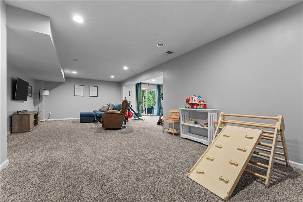 110 Brook Side Drive Clinton, PA 15026 - Photo 43 of 49 a living room with furniture and a flat screen tv