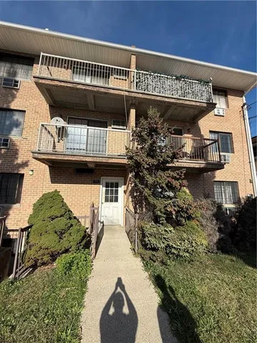 an aerial view of a house with a swimming pool