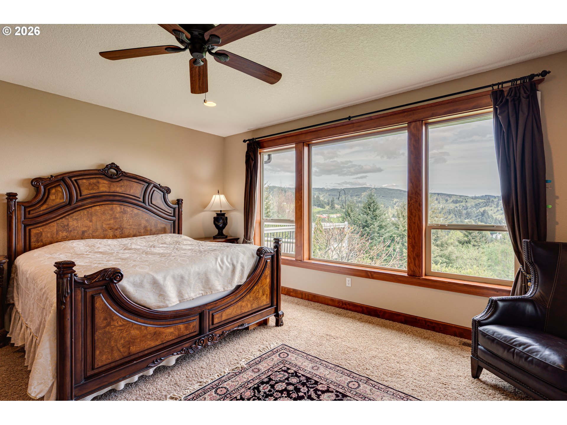 200 Pine Ridge Drive Woodland, WA 98674 - Photo 15 of 48 a bedroom with a bed and glass window