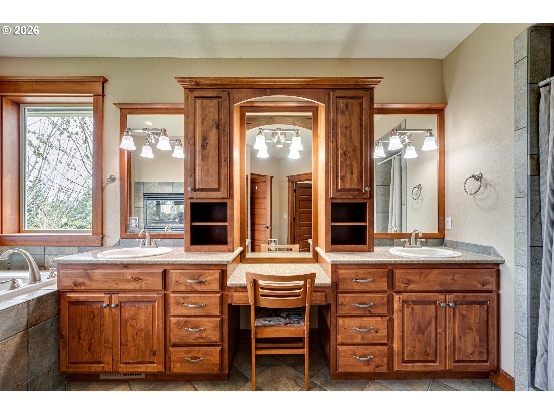 200 Pine Ridge Drive Woodland, WA 98674 - Photo 17 of 48 a bathroom with a sink a large mirror and a window