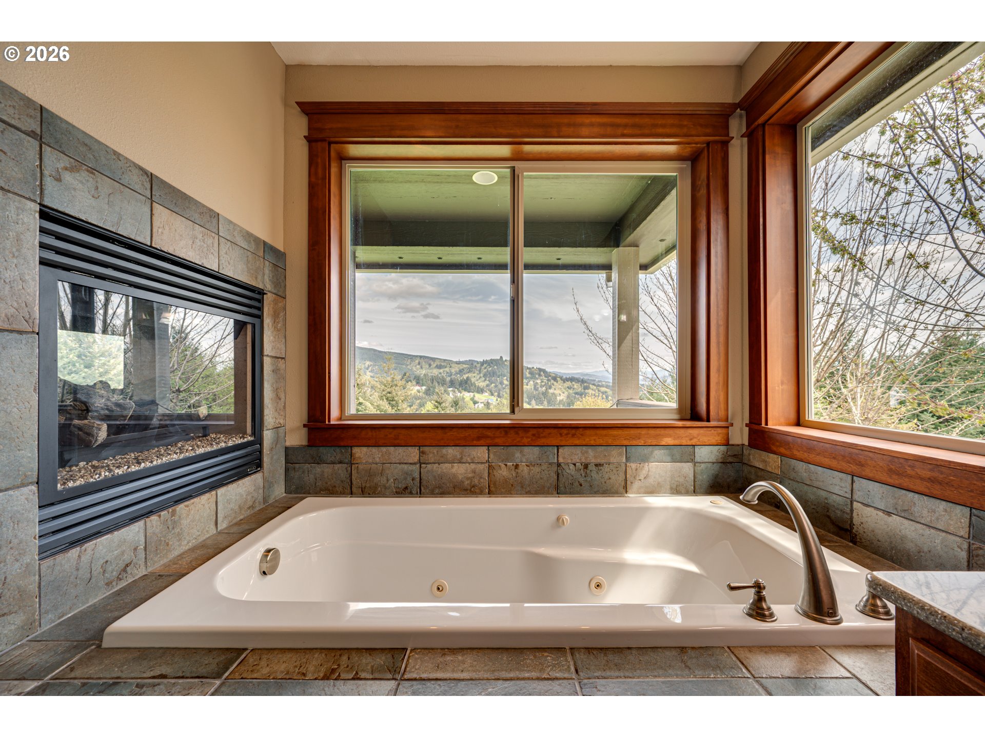 200 Pine Ridge Drive Woodland, WA 98674 - Photo 18 of 48 a bath tub sitting next to a window