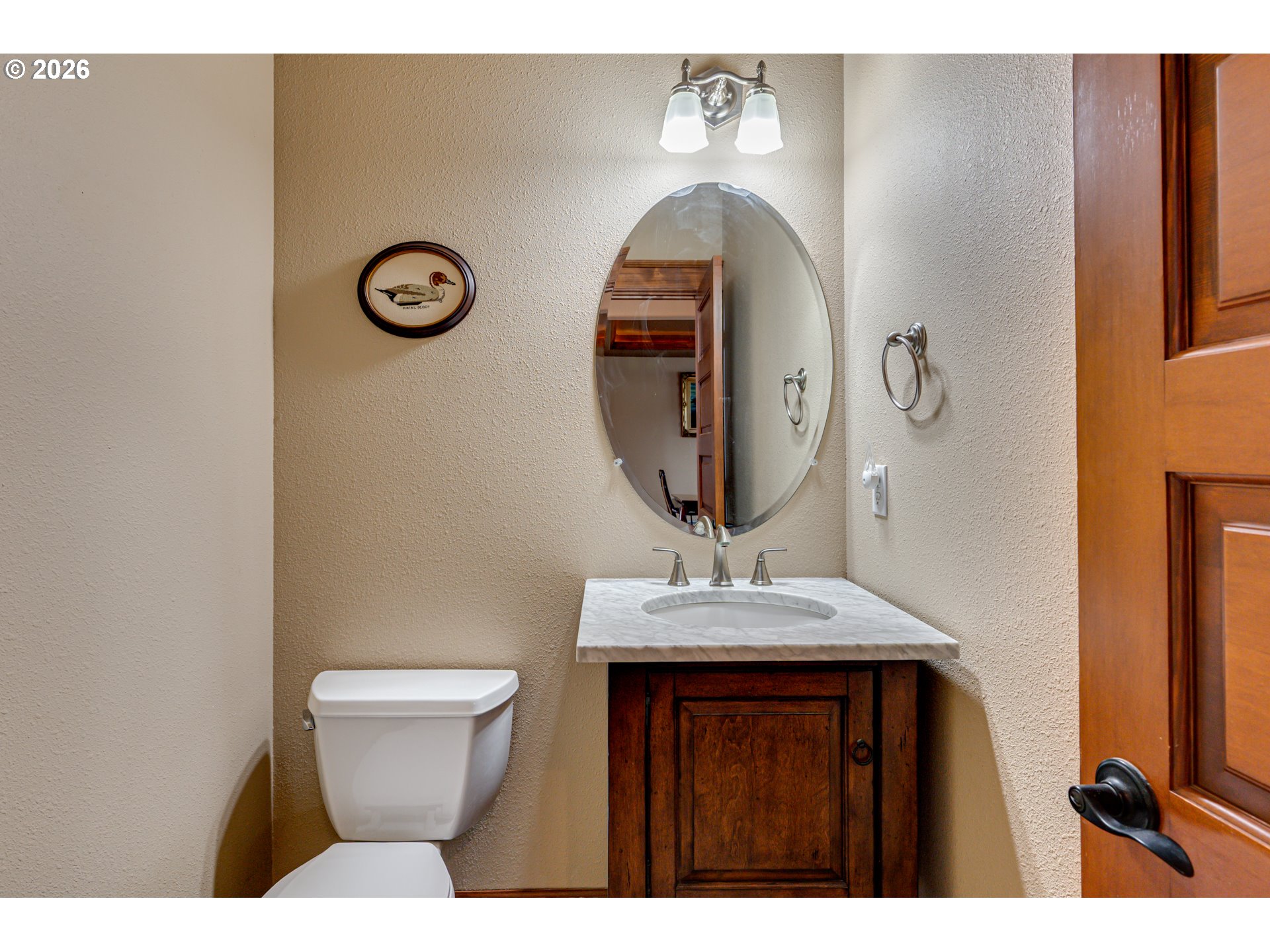 200 Pine Ridge Drive Woodland, WA 98674 - Photo 20 of 48 a bathroom with a toilet sink and mirror