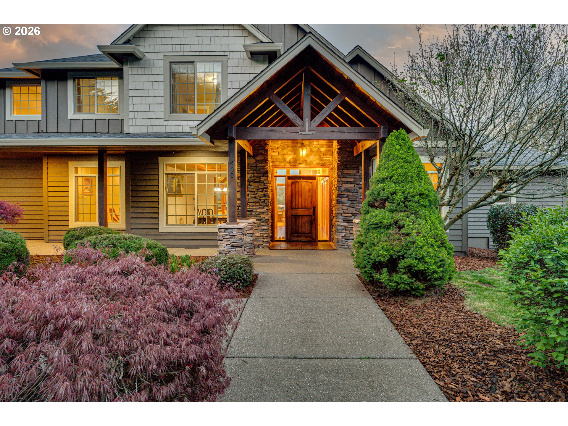 200 Pine Ridge Drive Woodland, WA 98674 - Photo 2 of 48 a front view of a house with garden