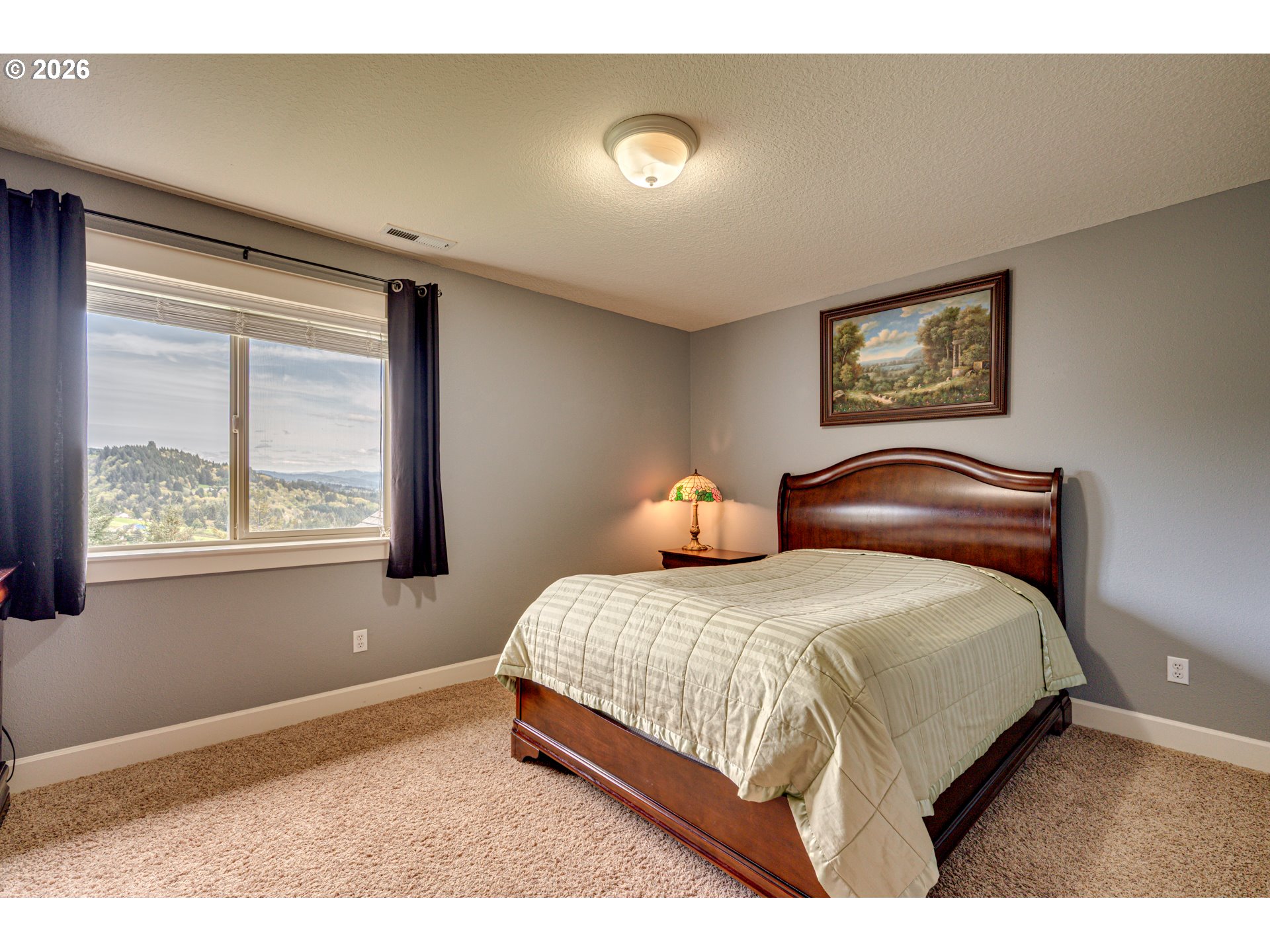 200 Pine Ridge Drive Woodland, WA 98674 - Photo 27 of 48 a bedroom with a bed and window