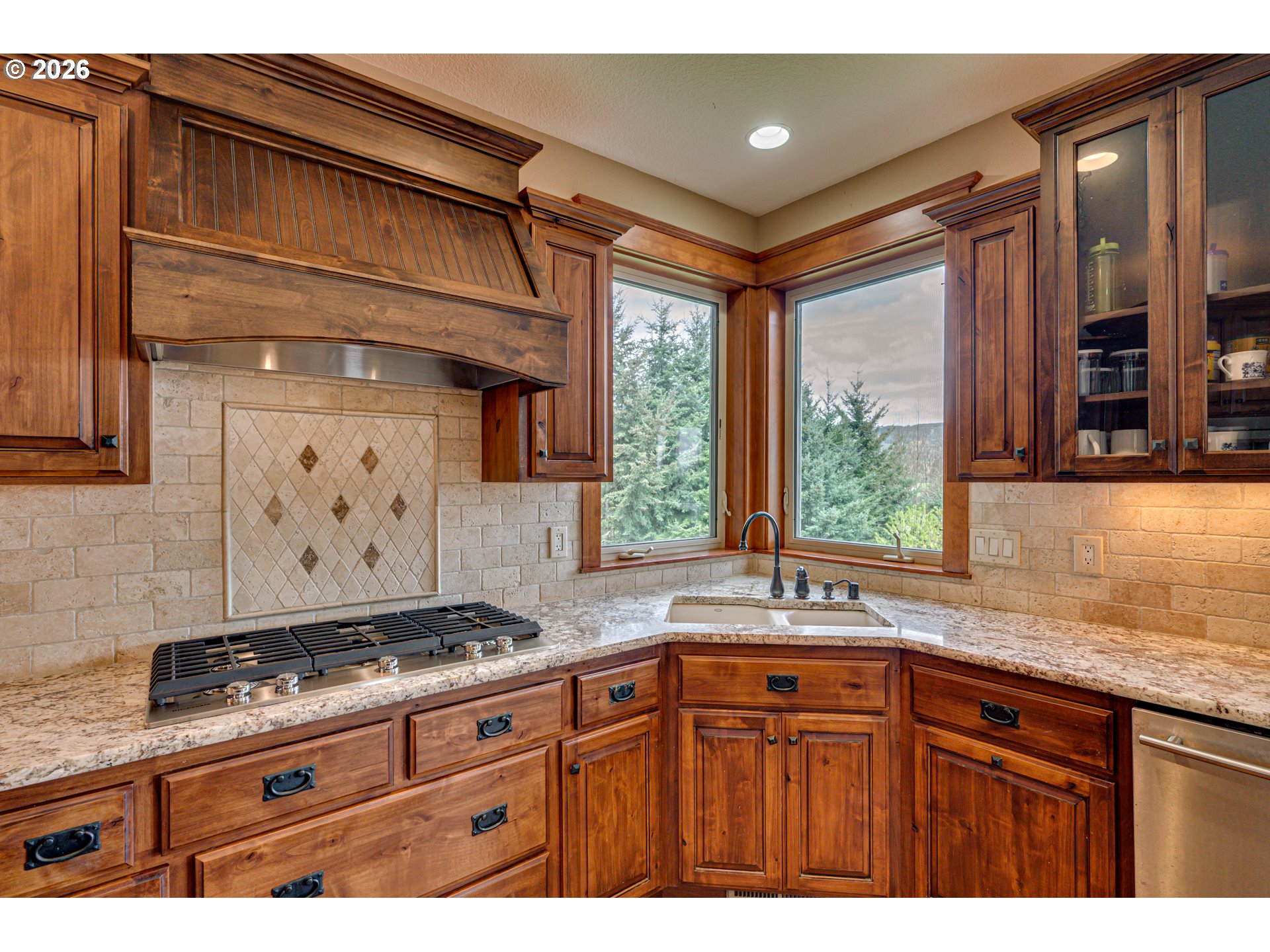 200 Pine Ridge Drive Woodland, WA 98674 - Photo 5 of 48 a kitchen with granite countertop a sink stainless steel appliances and cabinets