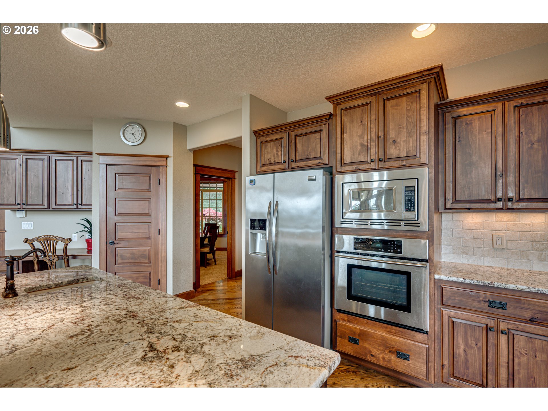 200 Pine Ridge Drive Woodland, WA 98674 - Photo 6 of 48 a kitchen with stainless steel appliances granite countertop a refrigerator and a stove top oven