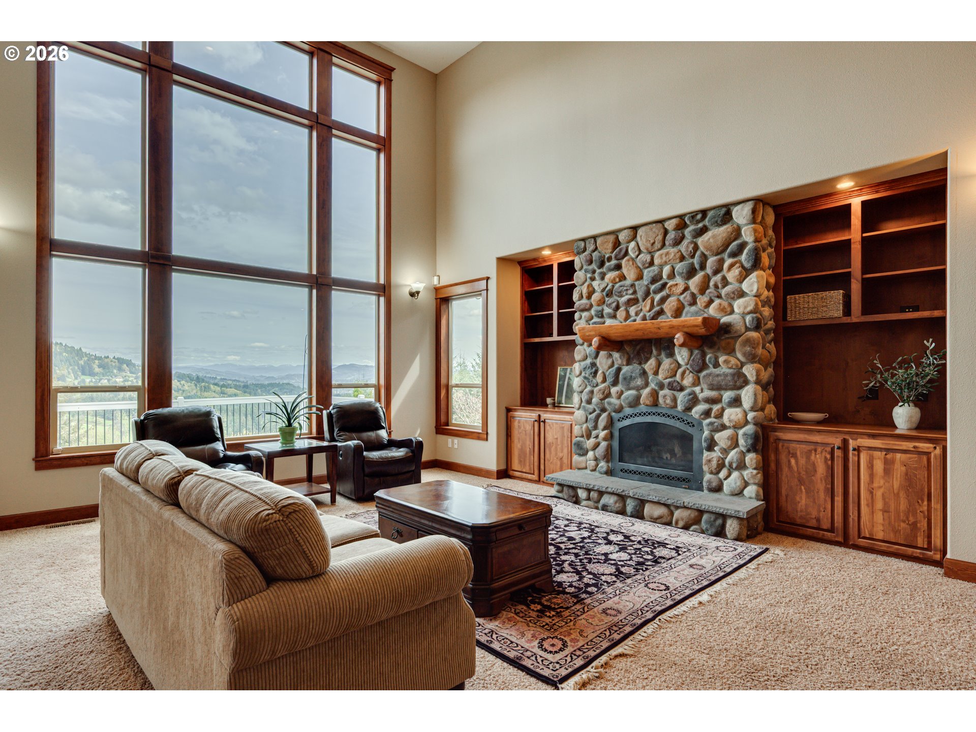 200 Pine Ridge Drive Woodland, WA 98674 - Photo 9 of 48 a living room with furniture a large window and a fireplace