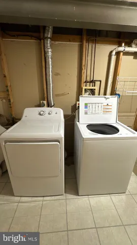 a utility room with washer and dryer