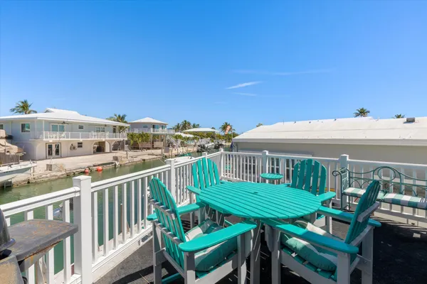 a view of a balcony with chairs