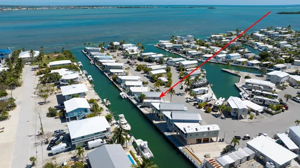 an aerial view of a house with a ocean view