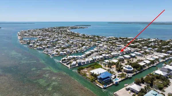 a view of a balcony with chairs and a table