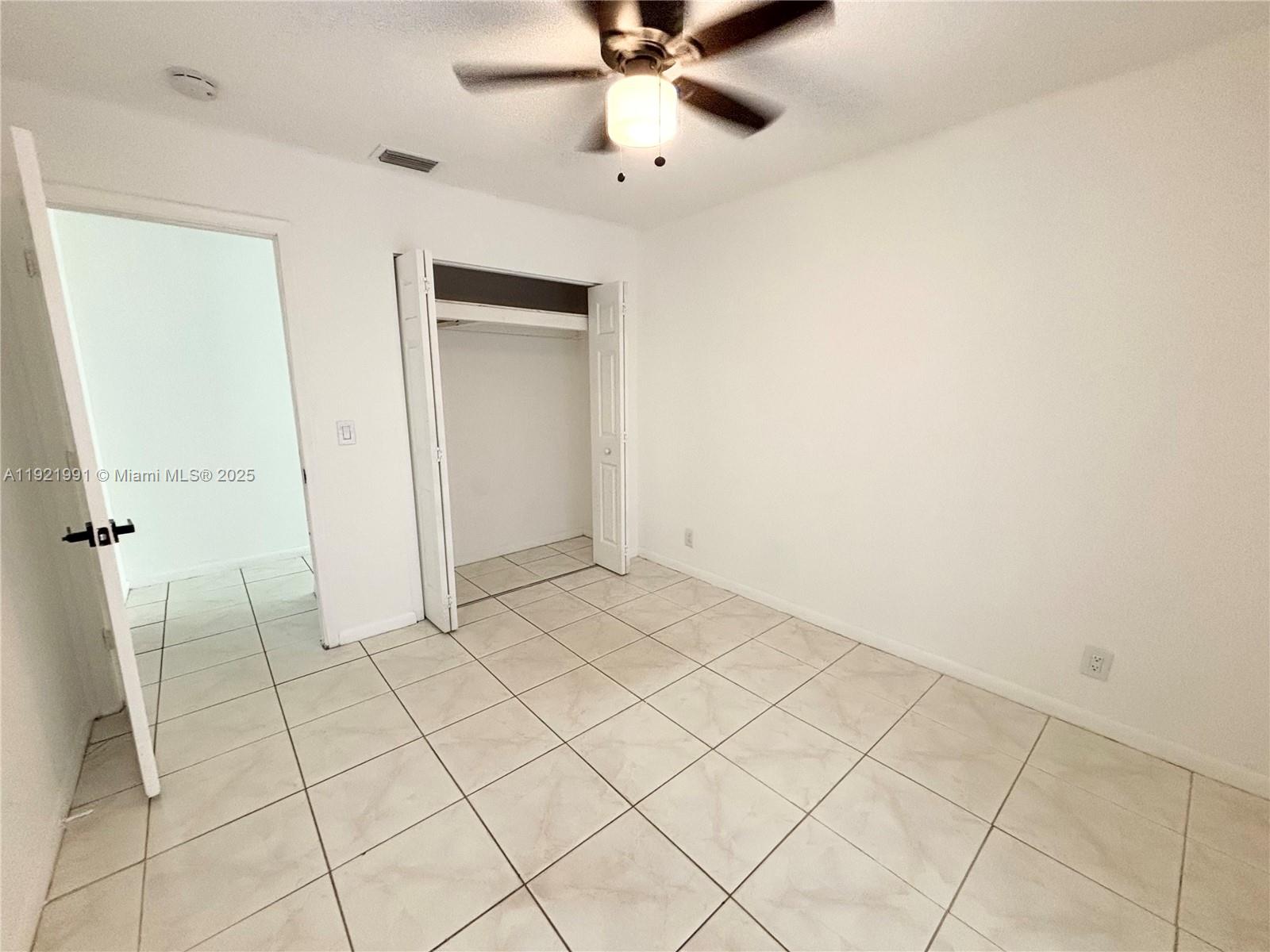 3203 Northwest 5th Terrace, Unit 4 Pompano Beach, FL 33064 - Photo 5 of 8 a view of an empty room