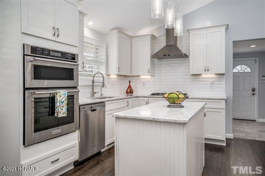 9629 Fonville Road Wake Forest, NC 27587 - Photo 6 of 22 Large quartz work island and upgraded stainless appliances!