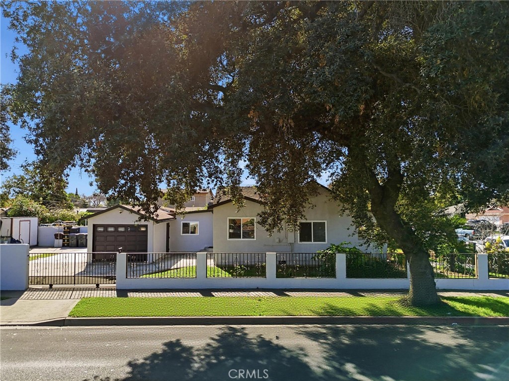 2101 South Hickory Street Santa Ana, CA 92707 - Photo 1 of 44 a view of a house with swimming pool and a yard