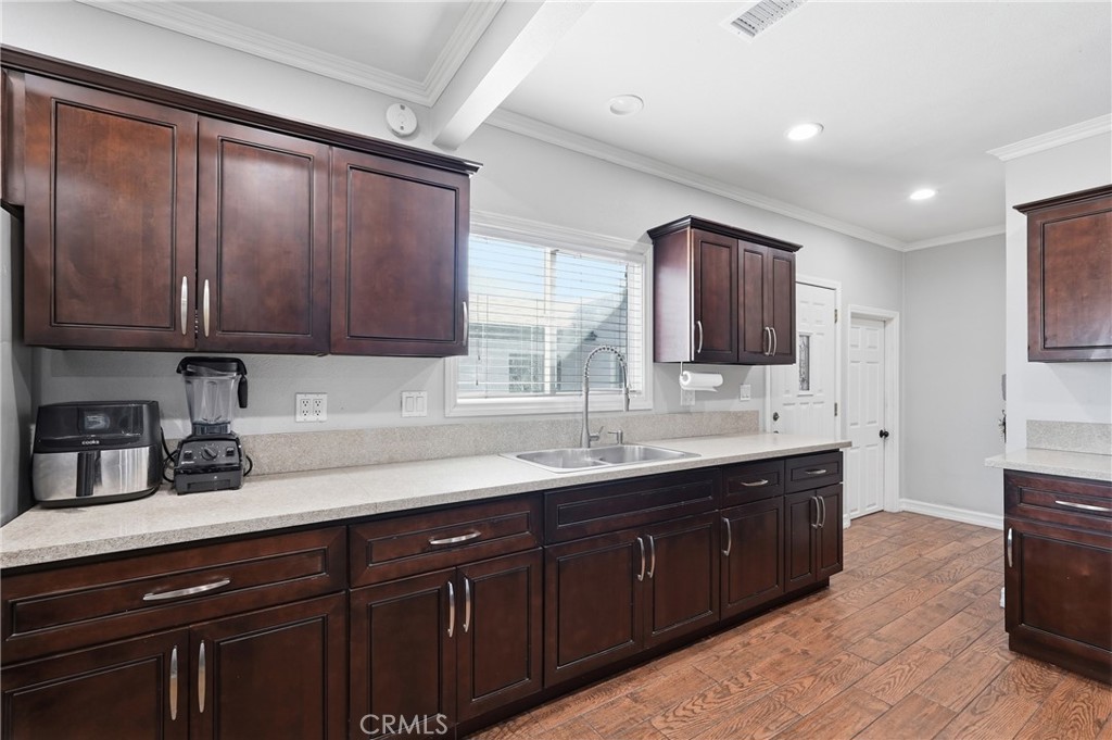 2101 South Hickory Street Santa Ana, CA 92707 - Photo 16 of 44 a kitchen with a sink and cabinets
