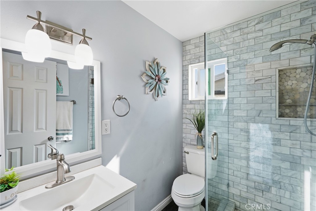 2101 South Hickory Street Santa Ana, CA 92707 - Photo 24 of 44 a bathroom with a toilet sink and shower