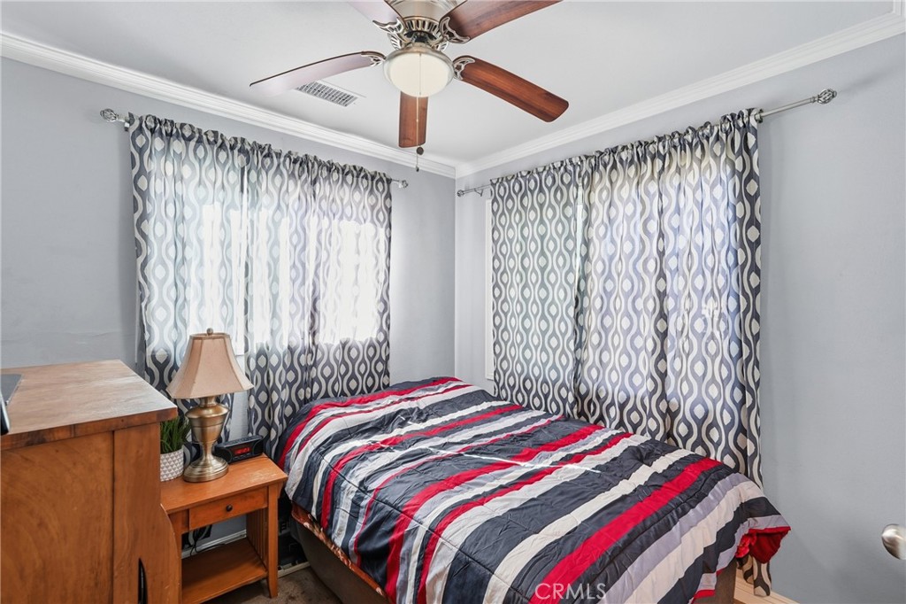 2101 South Hickory Street Santa Ana, CA 92707 - Photo 28 of 44 a bedroom with a bed and a chandelier