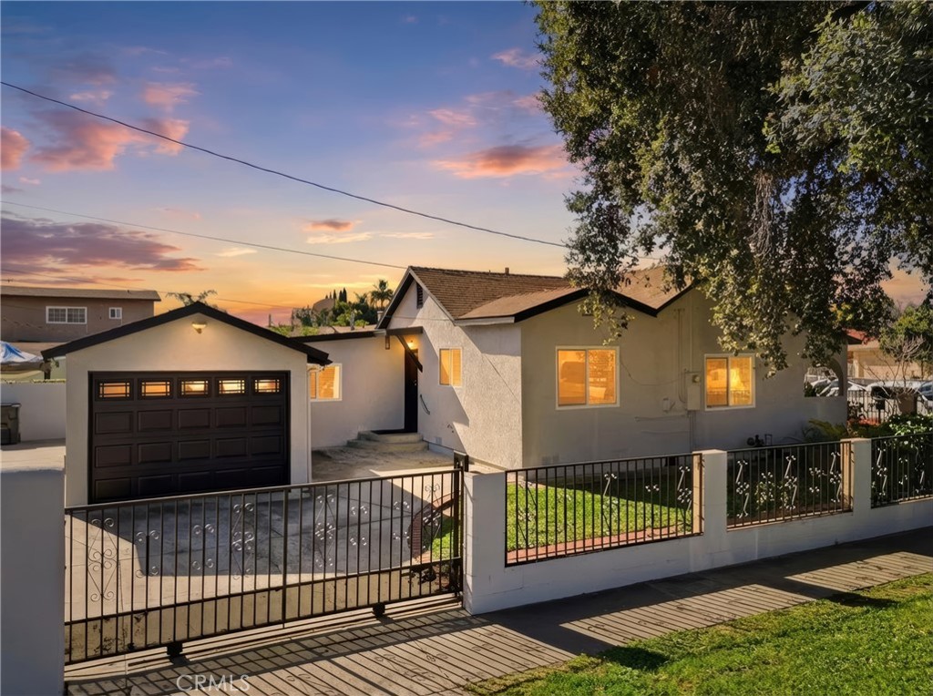 2101 South Hickory Street Santa Ana, CA 92707 - Photo 6 of 44 a front view of a house with a garden and deck