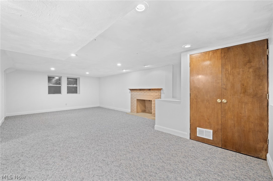 2968 Glengary Road Cleveland, OH 44120 - Photo 43 of 49 Basement featuring carpet and a brick fireplace
