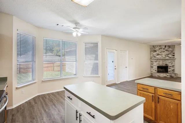 a kitchen with a stove a sink and a refrigerator