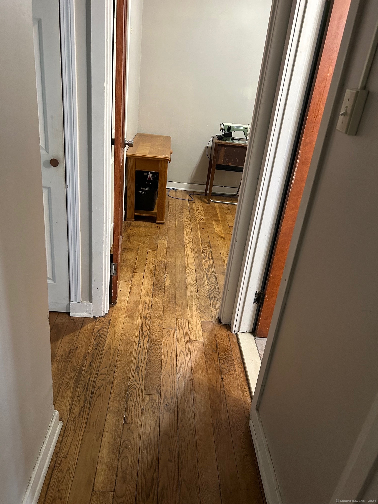 260 Success Avenue, Unit 21 Bridgeport, CT 06610 - Photo 9 of 15 a view of a hallway view with wooden floor and staircase